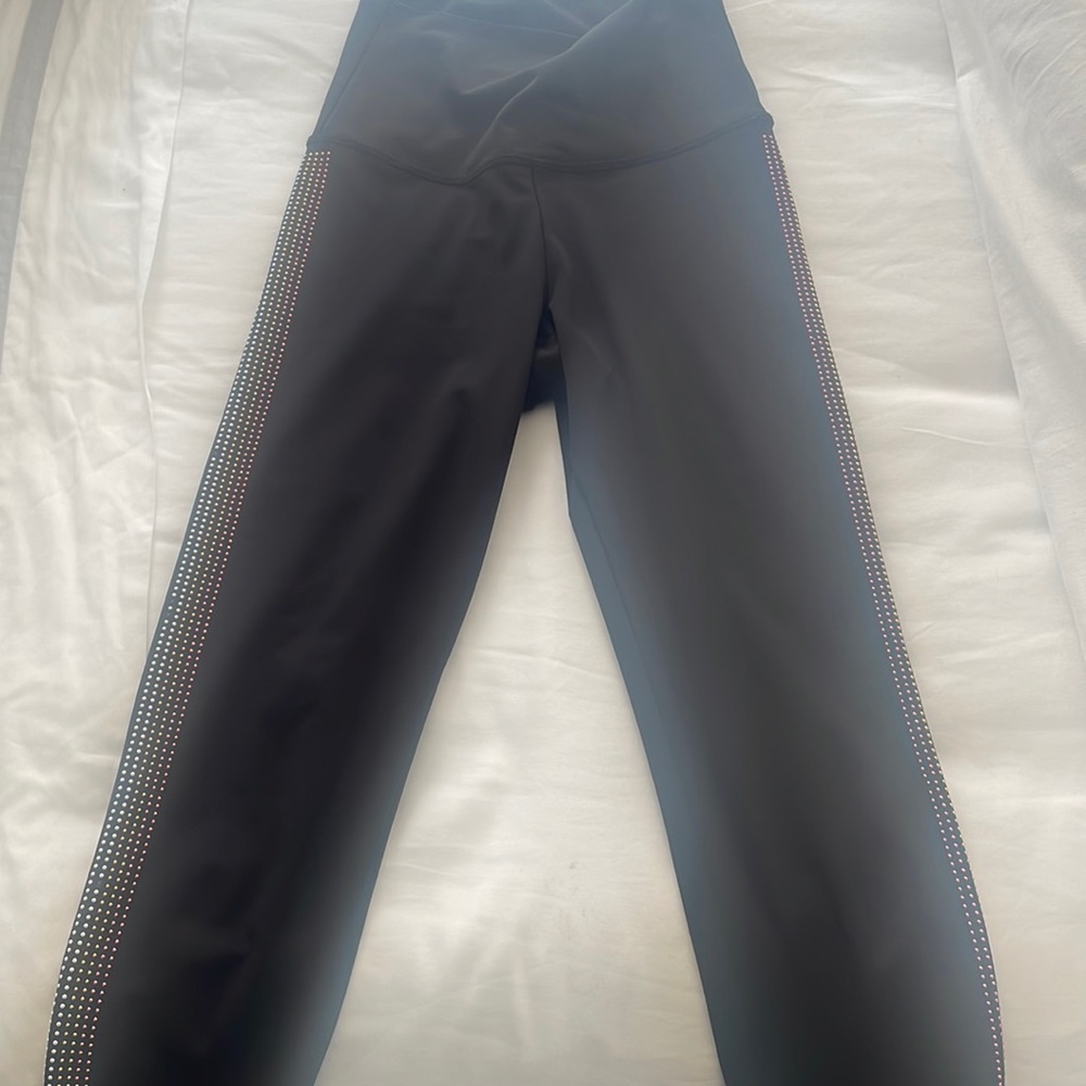 Beach Riot black workout leggings with decorative dots on sides